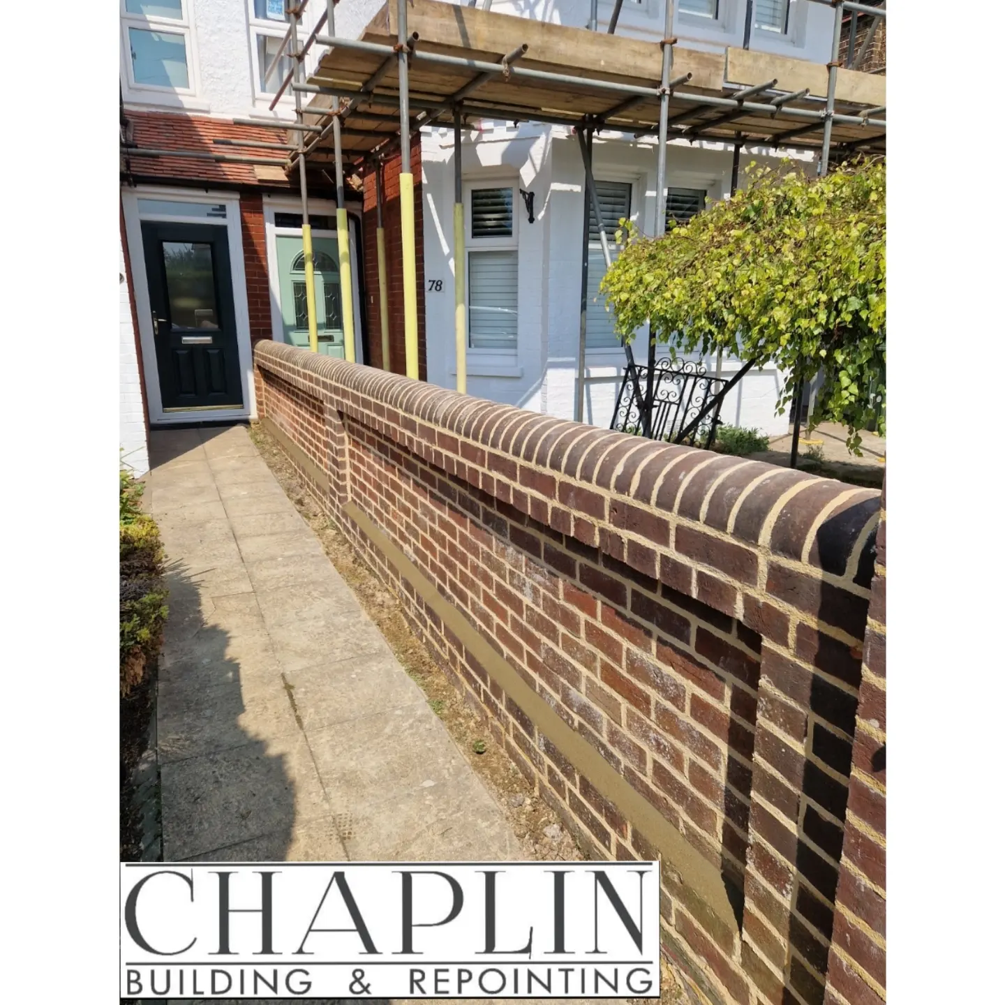 Repointed red-brick front garden wall with half-round coping